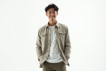 Half-Length (Waist-Up) portrait of young stylish smiling Indonesian male model in preppy wear isolated on pure white background looking at camera