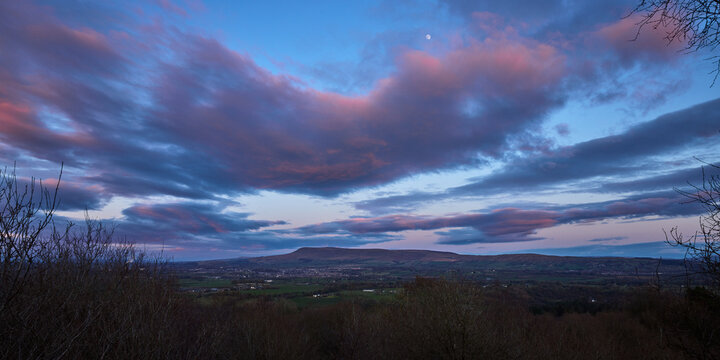 Last light hitting the hill and under side of the clouds, Pendle Hill from Longridge Fell, Clitheroe, Lancashire, UK
