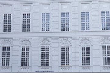 Fototapeta premium A detailed close-up shot of the windows of Hofburg Palace in Vienna, capturing the intricate architectural design and grandeur of the building