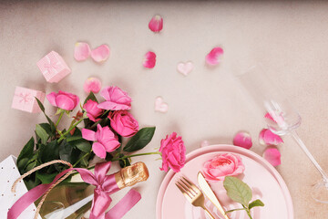 A charming Valentine's Day scene with pink plates, a champagne flute, fresh roses, heart decorations, and small romantic gifts.