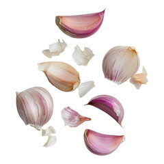 A collection of garlic cloves and skins scattered in various positions.