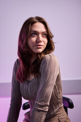 Obraz premium Stylish Young Woman Captured in a Modern Office Setting, Exuding Charm and Confidence
