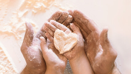 Family Love. Father And Daughter Holding Heart Shaped Dough On Hands Baking Together In Kitchen Indoor. Closeup, Panorama