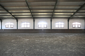 View in an indoor riding hall for horses and riders. The riding school is suitable for dressage and...