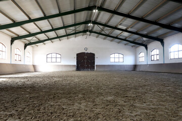 View in an indoor riding hall for horses and riders. The riding school is suitable for dressage and...