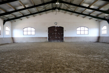View in an indoor riding hall for horses and riders. The riding school is suitable for dressage and...