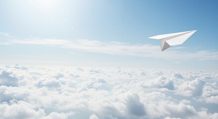 Fototapeta premium White paper airplane soaring through bright blue sky exuding a sense of freedom and adventure while gliding above soft, fluffy clouds