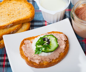 Sandwich with homemade chicken liver pate, green cheese and vegetables