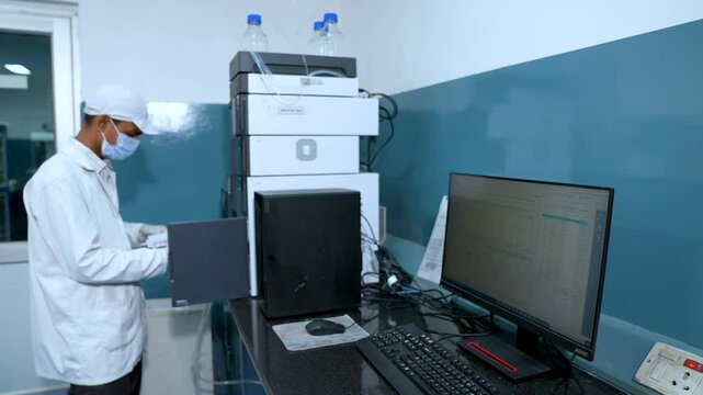 Fda approved science laboratory with hplc, spectrometer, gc, uv, ir in background. hi tech machines and equipments in a Science experiment lab for research, clinical trial study. fda approved labs