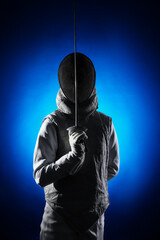 Fencer with epee on dark blue background