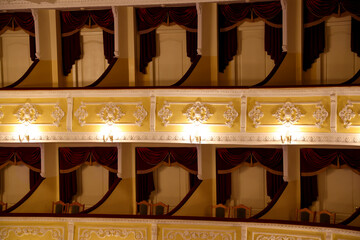 Balconies with comfortable chairs and vintage lamps in theatre