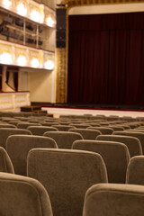 Rows of gray comfortable seats in theatre, closeup