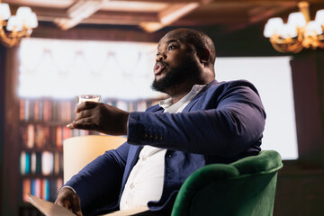 African american secret service agent in a classy headquarters library, briefing each other on...
