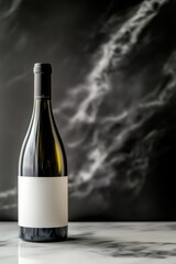 Fototapeta premium Elegant wine bottle on marble surface with dark artistic background