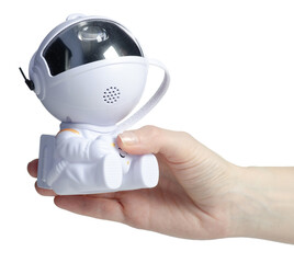 Hand holding astronaut starry sky projector on white background isolation