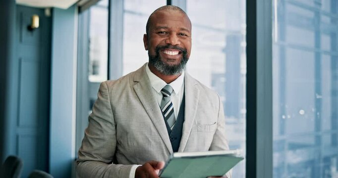 Tablet, face and mature businessman by window in office reading stock market development for investment. Digital technology, communication and male financial manager with email for finance proposal.