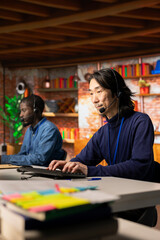 Experienced call center senior agent talking in headset mic, helping customers regain access to...