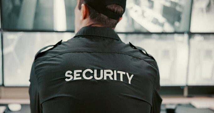Back, security guard and man in control room, video surveillance and computer with safety service. Person, monitor employee in workplace, uniform or expert with inspection, camera or cctv with screen
