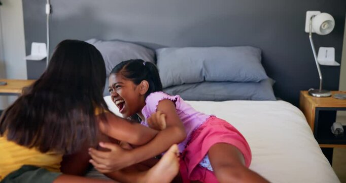 Happy, tickle and children on bed for playing, bonding and sister relationship in morning. Family home, siblings and young girls in bedroom for laughing, having fun and playful together for childhood