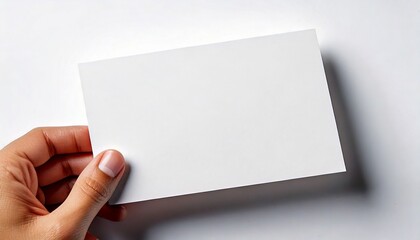 Hand holding blank business card. Blank card in hand. Mockup card. Mockup paper.