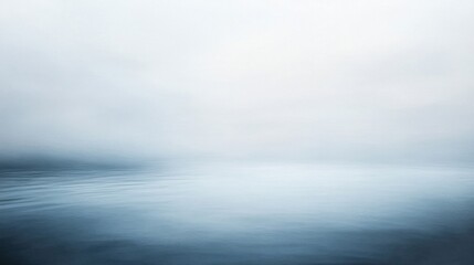 Fototapeta premium Serene Blue and Grey Fog Over Calm Water