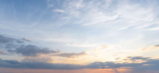 Fototapeta premium Low angle view and full frame of beautiful morning or evening blue and orange sky with cloudy while sunsets or sunrises taken at the sea used as natural blackground texture