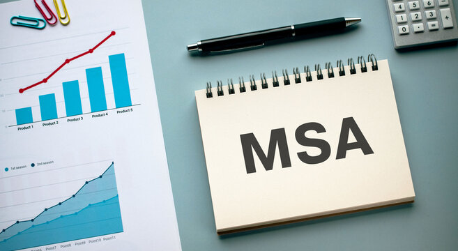 There is notebook with the word MSA. It is an abbreviation for Master Service Agreement as eye-catching image.