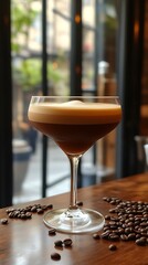 A layered coffee beverage presented in a stemmed cocktail glass