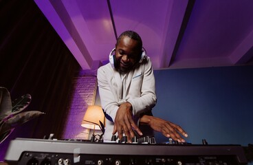 Energetic DJ Mixing Beats in a Colorful Atmosphere