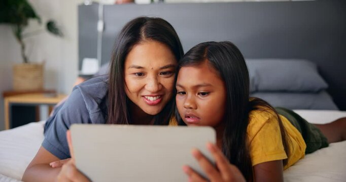 Tablet, mother and conversation with child in home for movie choice, ebook or together in family bedroom. Kid, girl or happy mom with digital technology for learning online, game app or watch cartoon