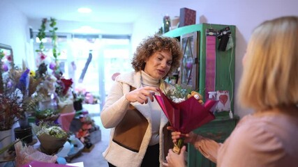 Creating beautiful floral arrangements in a cozy shop for special occasions