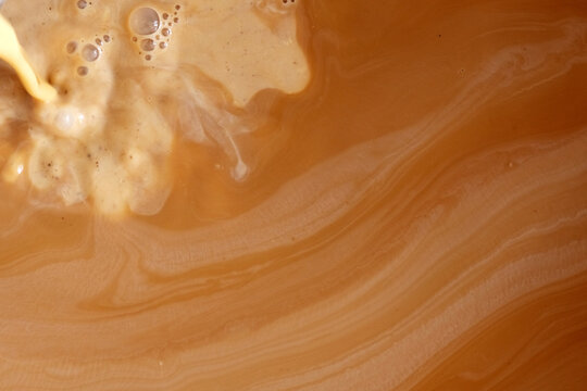 Mixture of black tea with evaporated milk for making milk tea