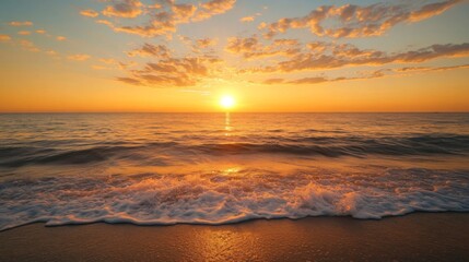 Obraz premium Orange Sunset Over Calm Ocean Waves on Sandy Beach