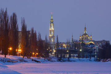 Obraz premium Cathedral of the Saviour's Transfiguration, Tambov city, Tambov region, Russia. Evening winter landscape with a church and a high bell tower. Night illumination of buildings. Architectural landmarks.