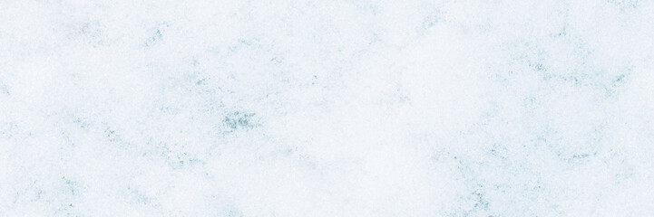 Natural snow texture. The surface of clean fresh snow. Snowy ground. Wide panoramic winter background with snow patterns. Perfect for Christmas and New Year design. Closeup top view.