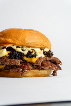Delicious Smash Burgers on White Background &ndash; Bacon Jam and white sauce