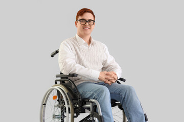 Office worker in wheelchair with eyeglasses on light background