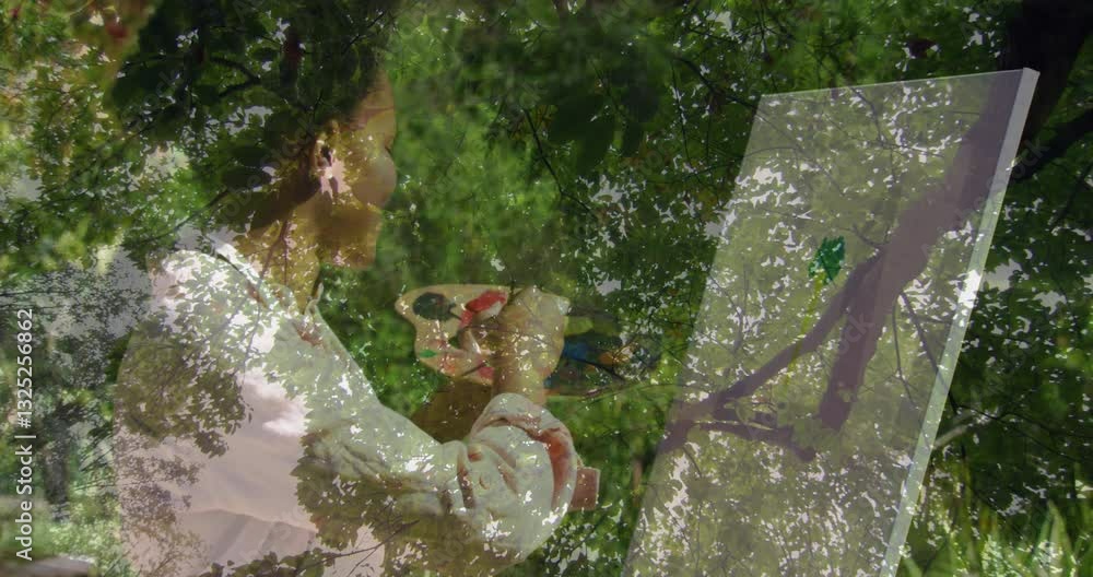 Poster painting on canvas, person creating animation with nature scene in background