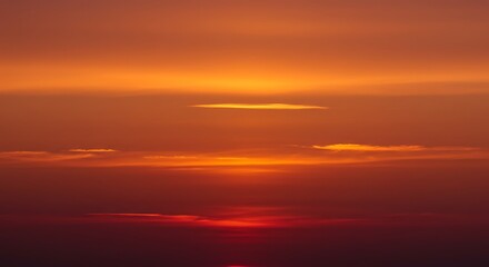 Fototapeta premium Fiery Sunset Hues: A Celestial Canvas