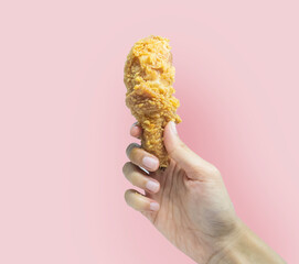 hand-held crispy fried chicken thighs