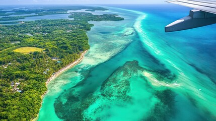 Fototapeta premium View from an airplane window flying over Florida, featuring turquoise waters, white sandy beaches, and the Everglades' lush wetlands. Palm trees and coastal cities dot the landscape. 