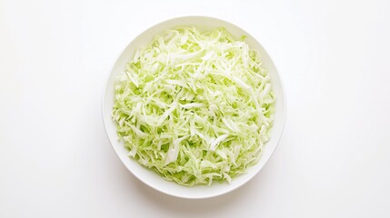 Grated fresh cabbage in a plate, top view on a white background, isolate