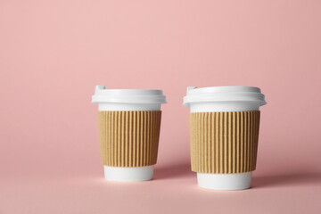 Paper cups on pink background. Mockup for design