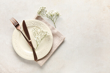 Beautiful table setting with gypsophila flowers on white background