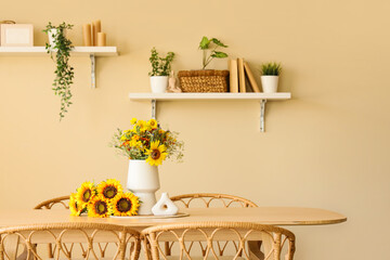 Dining table with wild flowers in room