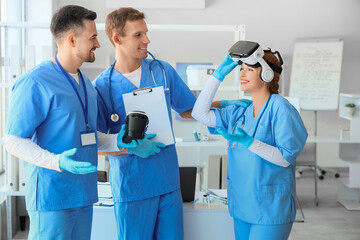 Young doctors with VR glasses in clinic