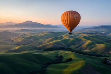 Obraz premium Hot Air Balloon Over Rolling Hills at Sunrise
