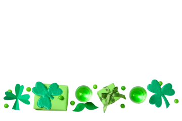 Patrick`s day, green gift boxes, clover leaves and green drink isolated on white background, top view, space for text, PNG