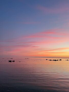sunset over the sea in finlands archipelago