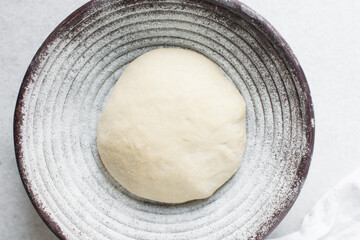 Overhead view of bread dough rising, top view of proofing dough, process of making artisan bread